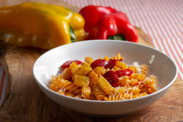 pasta with pepper cream and pieces of red and yellow pepper