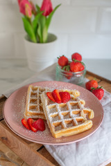 Tasty Belgian Waffles With Berries on a table