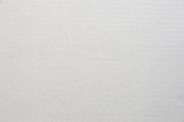 Sheet of brown paper or cardboard texture for background.