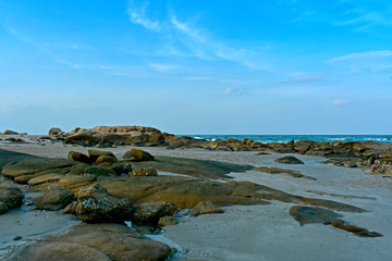 
The beach, the sea has rocks and sand. It is a beautiful atmosphere.