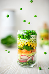 Fresh vegetable salad in a glass jar
