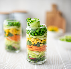 Fresh vegetable salad in a glass jar