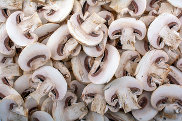 fresh sliced mushrooms close-up as background, top view