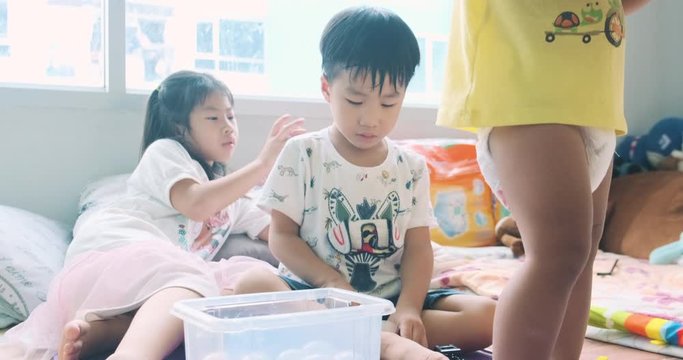 Adorable boy and girl kid group playing toy in cozy room developement preschool education