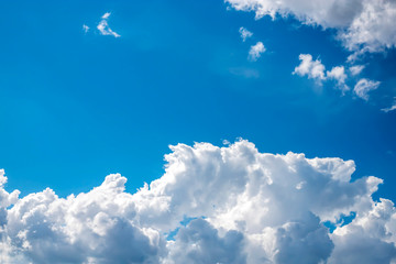 Naklejka na ściany i meble Blue sky with white clouds. Beautiful background. Place for text.