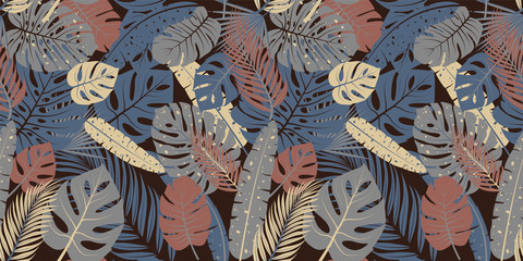 Seamless pattern with tropical leaves. Vector design.