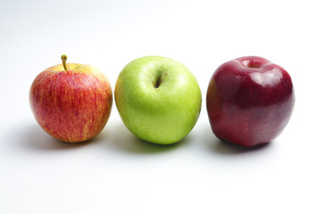 Three colors of apples on a white background