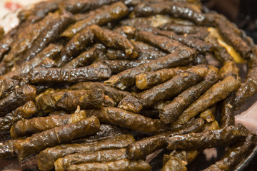 Turkish Traditional Cuisine, stuffed grape leaves. Turkish Sarma. Stuffed rice with green grape leaves.