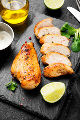 Grilled chicken breast. Sliced chicken fillet with lime.	
