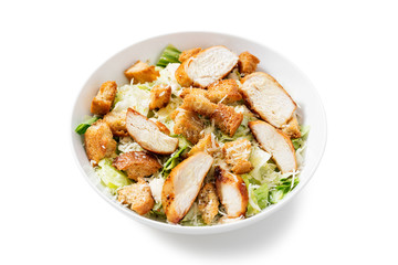 Classic caesar salad with grilled chicken fillet and parmesan cheese. isolated on white background