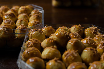 Nastar, an eid cookies with dark background and directional studio light