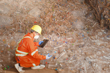 workers in recycling factory,engineers standing in recycling center.Garbage recycle in the factory...
