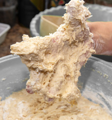 Hand stained in dough with flour.