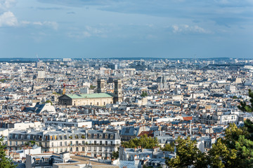 Fototapeta na wymiar Aerial view of the old town of Paris, view from the The Basilica of the Sacred Heart of Paris, at the summit of the butte Montmartre, the highest point in Paris, France