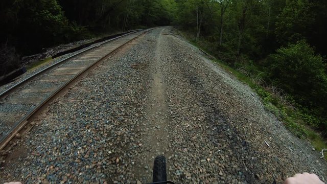 Riding Bike Along Train Tracks
