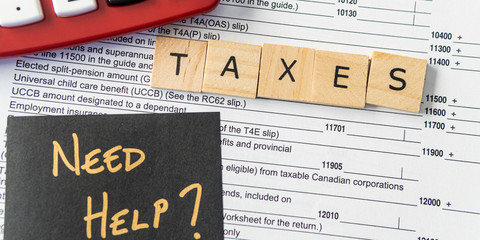 New Canadian personal tax forms and letter tiles showing refunds and taxes - Banner panorama