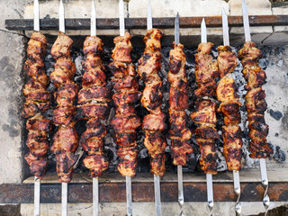 The meat on skewers is fried on charcoal
