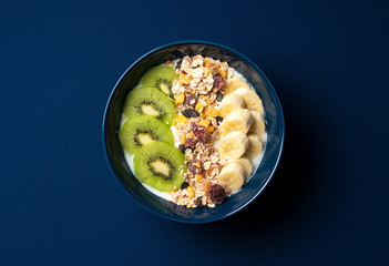 Granola and fruit on a dark blue background