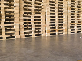 Wooden pallets stack at the freight cargo warehouse for transportation and logistics industrial 