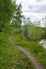 Nature summer, Ukraine. River and sandy steep shore, trees around the shore, landscape. Snow River, Ukraine