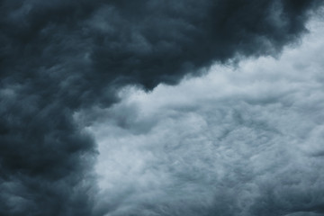 Fototapeta premium Dark dramatic clouds before a thunderstorm, hurricane, tornado.Abstract sky background.