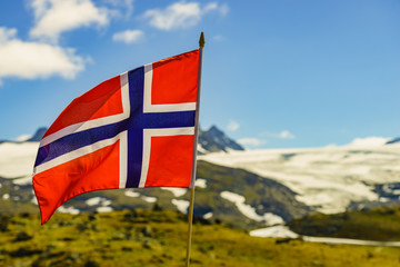 Norwegian flag and mountains snowy landscape