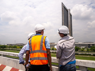 male engineers construction foreman managers outdoors
