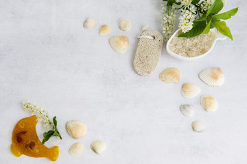 Concept of Spa-cosmetic and cosmetic procedures. Spa-sea salt in white dishes and seashells on...