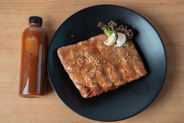 Pork rib grill with barbecue sauce on the plate