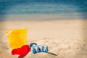 bucket, shovel, rake on the beach sand