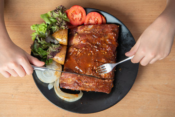 Pork rib grill with barbecue sauce on the plate
