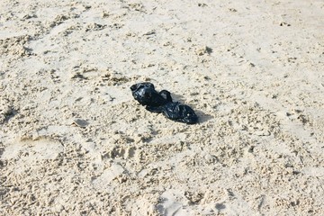 Plastic package on sand in Israel