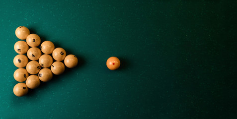Top view pyramid of billiard balls on the billiard table