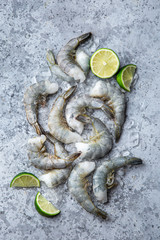 Fresh raw peeled prawns on ice
