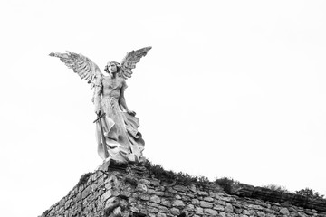 The exterminating angel. Old graveyard of Comillas, Cantabria (Spain). Black and White.