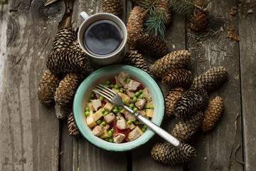 Wood table with fir cones and coffee