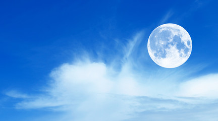 Naklejka na ściany i meble Blue sky with clouds and moon, natural background.