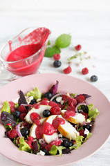Salad with raspberries and blueberries and chicken breast, seasoned with berry vinaigrette. Berry Vinaigrette Dressing