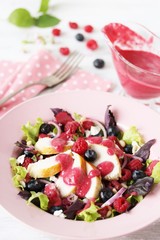 Salad with raspberries and blueberries and chicken breast, seasoned with berry vinaigrette. Berry Vinaigrette Dressing