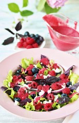 Salad with berries with vinaigrette. Vegetarian salad with raspberries and blueberries. homemade berry vinaigrette. 