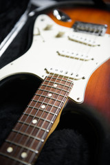 Fototapeta na wymiar A closeup photo of an electric guitar in a guitar case.
