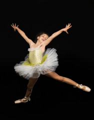 Girl in ballet with dress and sneakers