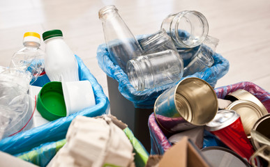 The four different container for sorting garbage. For plastic, paper, metal and glass