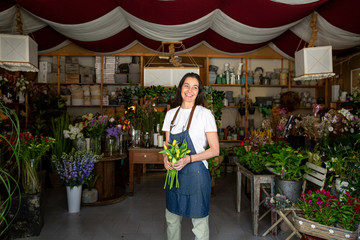 Fototapeta na wymiar smiling florist in her store