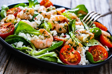Prawn salad on wooden table
