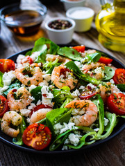 Prawn salad on wooden table
