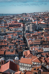 view of the center of lisbon, the elevator of santa justa and the carmo church between the buildings from theviewpoint of san jorge
