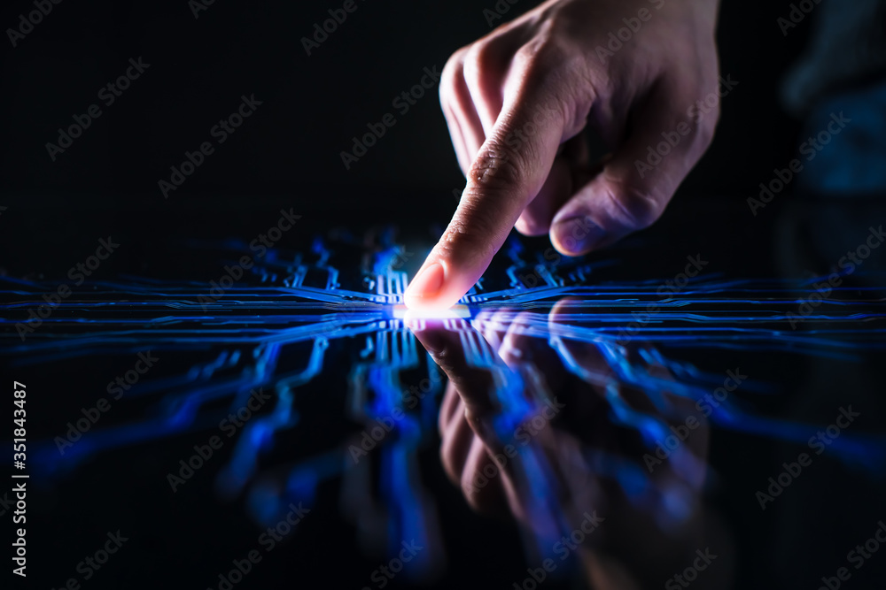Poster digitalization concept: human finger pushes touch screen button and activates futuristic artificial 