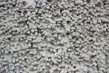 Grey wall made from concrete and gravel
