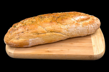 Fresh baked Rustic baguette on wooden board, isolated on black background